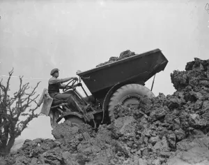 A mechanical navvy carrying away the spoil during the excavations on the site of