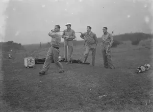 Members of Arsenal Football Club on the Dyke golf links at Brighton. Cliff Bastin driving off