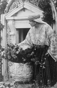In Memory of Her Baby The Queen of Romania arranging flowers on the grave of little