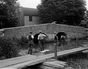 Bridge Prints: Men at work on river crossing at Eynsford bridge over the River Darent in Kent