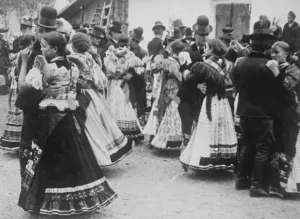 Mesokovesd, Hungary. Since it is all out of doors, the men keep their hats