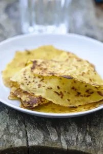 Mexican corn pancakes stacked on white plate credit: Marie-Louise Avery / thePictureKitchen