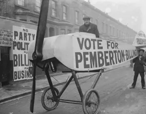 Mile End Election, Voter being taken to the booth in an aeroplane - Noel Pemberton