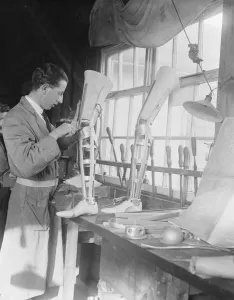 At the Ministry of Pensions artificial limb factory at Thames Ditton Assesing
