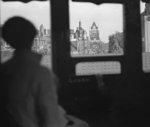 Window Prints: Miss Haken looking out the window of a train. 1936