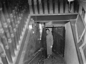 Door Prints: Miss Haken posing from the bottom of the stairs in Sidcup, Kent. 1937