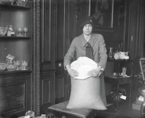 Wedding Prints: Miss Marjorie Pollock ( daughter of Sir Ernest and Lady Pollock ) with the sack of