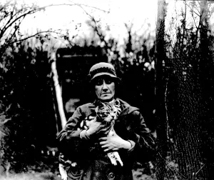 Miss Nancy Rutherford holding one of her many cats. (Otford) 1934