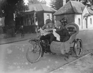 Side Car Prints: Miss Sybll Arundale and Miss Betty Fairfax out for a motor cycle trip Examining a map