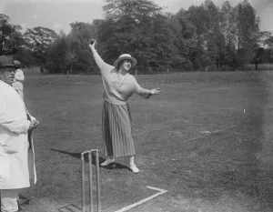 Playing Prints: Miss Violet Loraine bowls the first ball at the opening match of the Langley Park