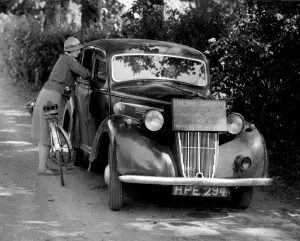 Bicycle Prints: Mobile Office for Collecting Electricity Dues A car is used as a mobile office for