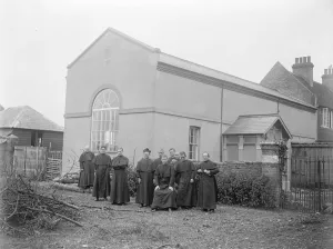 Priests Prints: Monks building feat. Hall and part Church erected by Brother Raymond ( sitting )