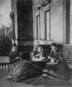 Victorian Prints: Mother and daughters enjoy their tea outdoors in the afternoon sun