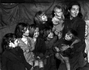 Mother with her seven children all looking very dirty 1948 photograph by John Topham