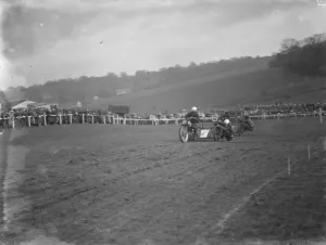 Motor cycling races at Brands Hatch A side car bike takes a corner during the race 1936