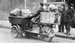 Motorcycle Prints: A motor postman. A new feautre with the postal authorities is to provide the rural