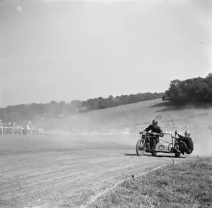 Motorcycle racing at Brands Hatch, Kent. A sidecar motorbike takes a corner