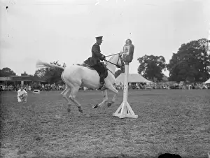 A mounted policeman competing in the truncheon event at the Metropolitan
