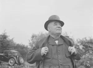 Mr Charlie Hever wearing a tar painted bowler hat in Eynsford, Kent