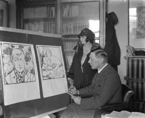 Mr G E Studdy and Mrs Studdy inspect winning poster for geranum day Mr G E Studdy