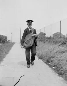 Elderly Prints: Mr J Sperring a postman is retiring from his rounds in Chislehurst, Kent