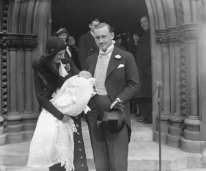 Baby Prints: Mr and Mrs FA Gardiner and their infant son after the babys christening at St Marks Church
