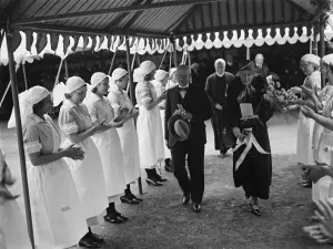 Event Prints: Mr Tuberville walks through a guard of honour formed by nurses at the Alexandra Hospital