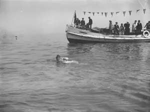 Mrs Corson swims the channel. Mrs Corson swimming with a powerful side stroke as