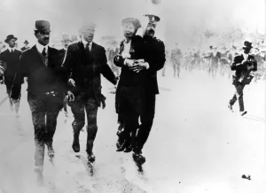Mrs Emmeline Pankhurst is lifted off the ground by a policeman during a demonstration