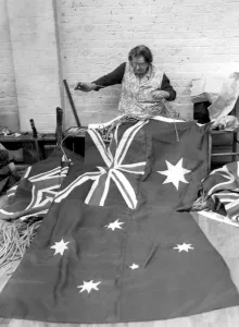 Mrs Gore works on the Australian Flag which is in preparation for the Coronation Mrs Gore works on the Australian Flag which is in preparation for the Coronation