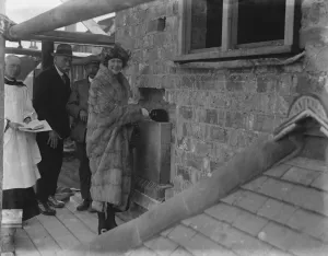Fur Coat Prints: Mrs Holman, daughter of Sir Jesse and Lady Boot lays the foundation stone of
