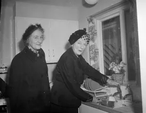 Kitchen Prints: Mrs Winston Churchill, wife of the Prime Minister does a bit of washing up in