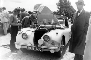 Bonnet Prints: Munich: British driver Ian Appleyard services his Jaguar car at the Munich check