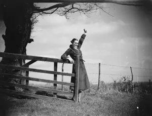 Waving Prints: Muriel Haken waves from a gate. 1939