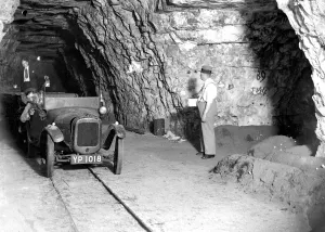 Mushroom growing at a Chislehurst cave. An Austin 7 is used for transport. 1934