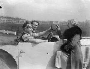New motor track near London. Miss Rita Cooper, the actress, giving Mr Adrian