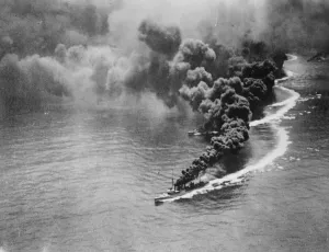 New smoke screen. US battleship off San Pedro steam away from the coast