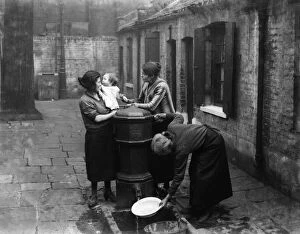 Water Collection: Newtons rents off Twine Court in Shadwell - the centre of one of the worst slums in Stepney