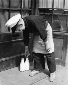 Apron Prints: Norman Whiting, aged 11, plays at being a real milkman on Saturdays and Sundays
