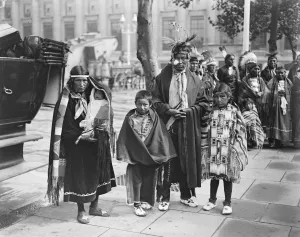 North American Indians arrive in England. An Indian Chief and his family outside