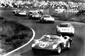 World Champion Prints: Nurburgring Germany John Surtees swings his Ferarri into a bend as he leads