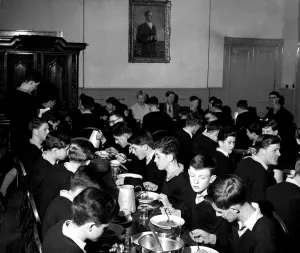 An oil painting of Prince Philip - an old boy of the school - looks down on the dining