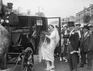An old fashion wedding at Eltham Parish church. The bride climbing onto the horse