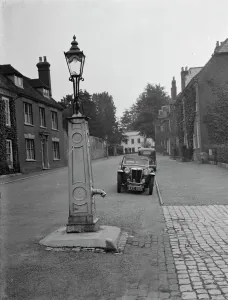 An old water pump used as a street lamp. West Malling. 14 September 1937
