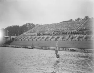 Olympic Games Prints: Olympic Games at Antwerp A high diver just about to enter the water 24 August 1920