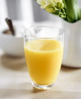Orange juice as part of a light healthy breakfast credit: Marie-Louise Avery /