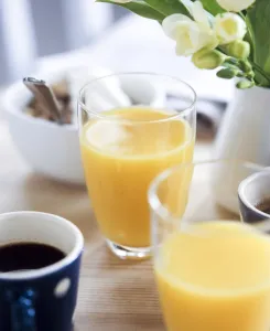 Bowl Prints: Orange juice as part of a light healthy breakfast credit: Marie-Louise Avery /