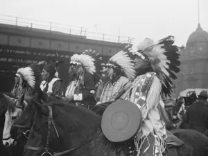 Original caption: Arrival of Red Indians in London. To appear at Olympia Circus