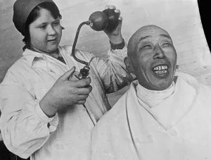 Original caption: He likes the spray! Oriental impassiveness gave place to a broad