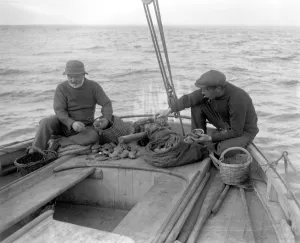 Baskets Prints: Ormering in the Channel Isles. Fishermen fishing for abalone or ormers. 8 October 1920